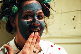 Woman in Makeup and Curlers