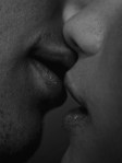 Man and women kissing just lips black and white photo